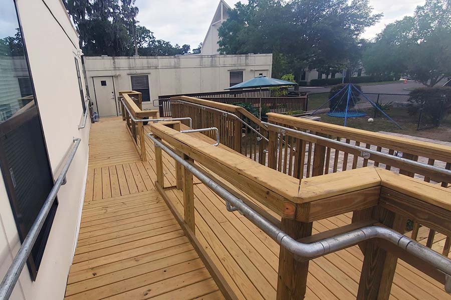 ADA handrail on wooden ramp