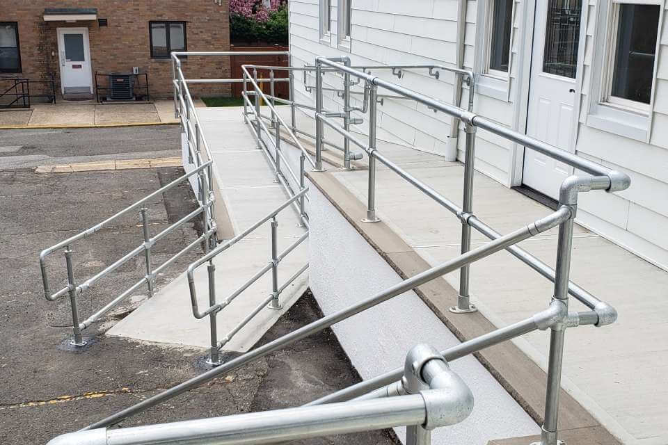 ADA handrails on a concrete ramp