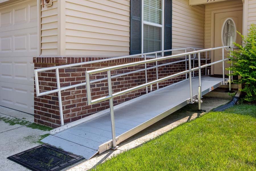 Metal wheelchair ramp on front steps