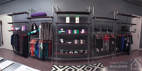 custom retail clothing racks with wood shelves