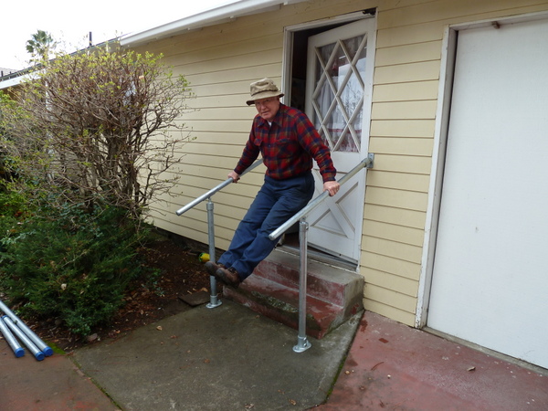 Elderly Man with Wall-Mounted Railing
