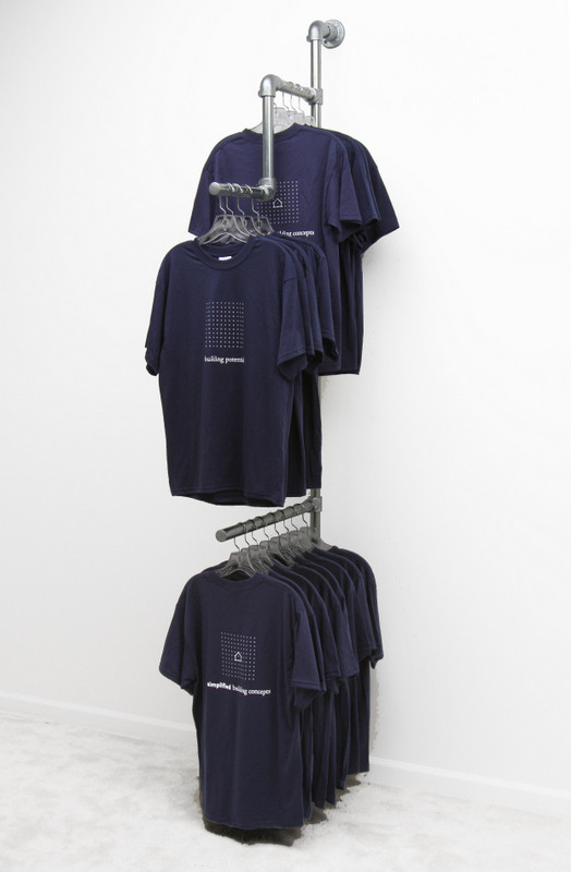 Multi leveled clothing rack hanging tee shirts