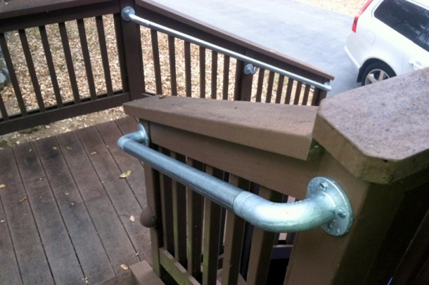 outdoor wood staircase with metal railing
