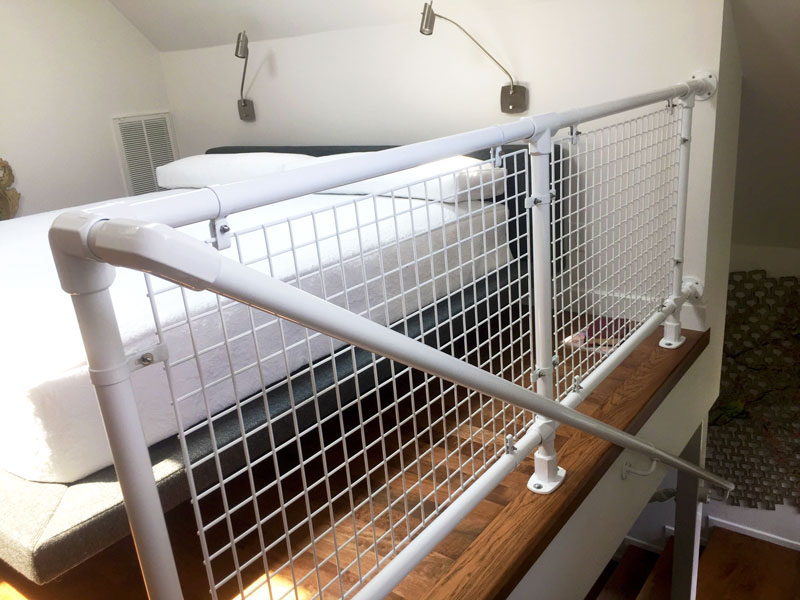 loft railing with mesh panels
