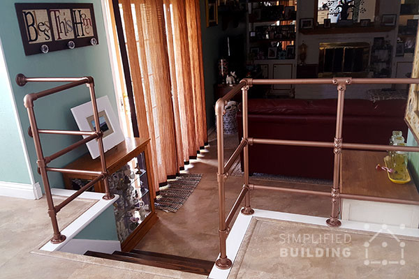 small indoor kitchen stairs with copper railing