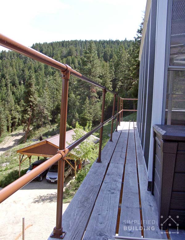 large balcony handrail with forest view