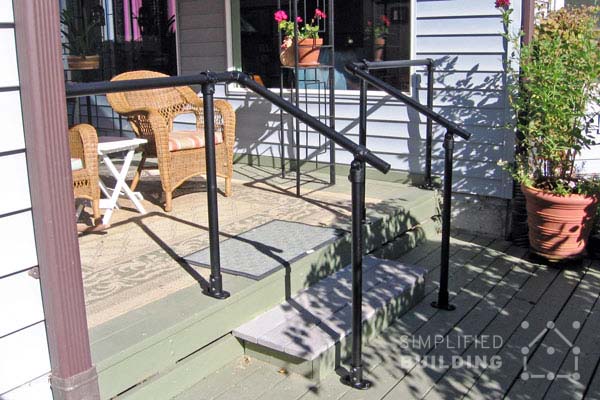 small back deck with handrails