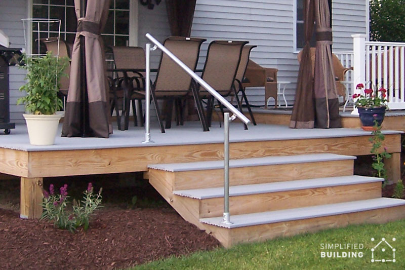 wooden deck with metal handrail
