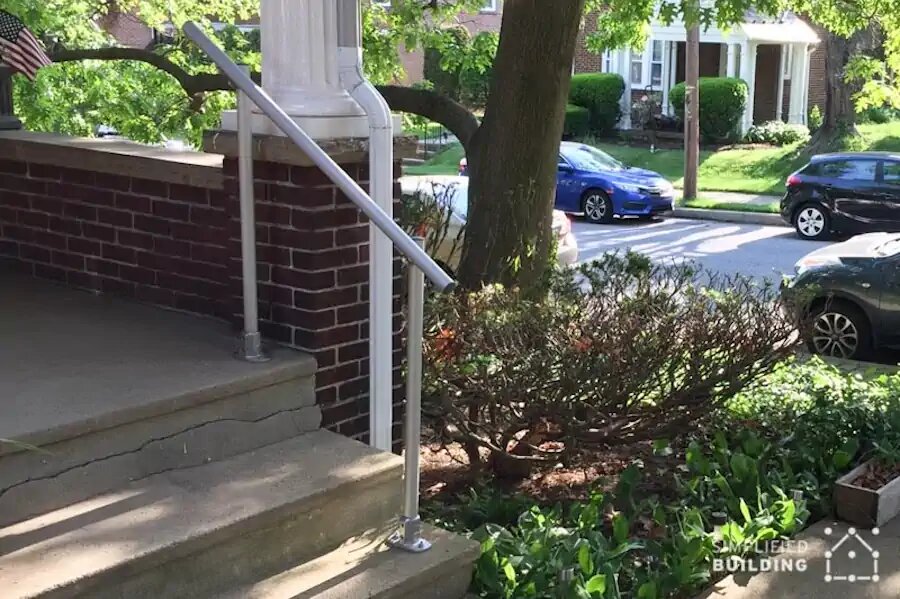 brick front porch with handrail
