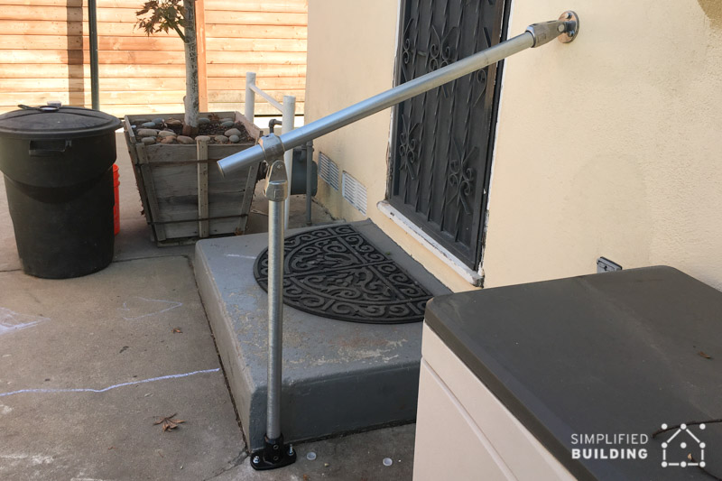 small step with mounted handrail
